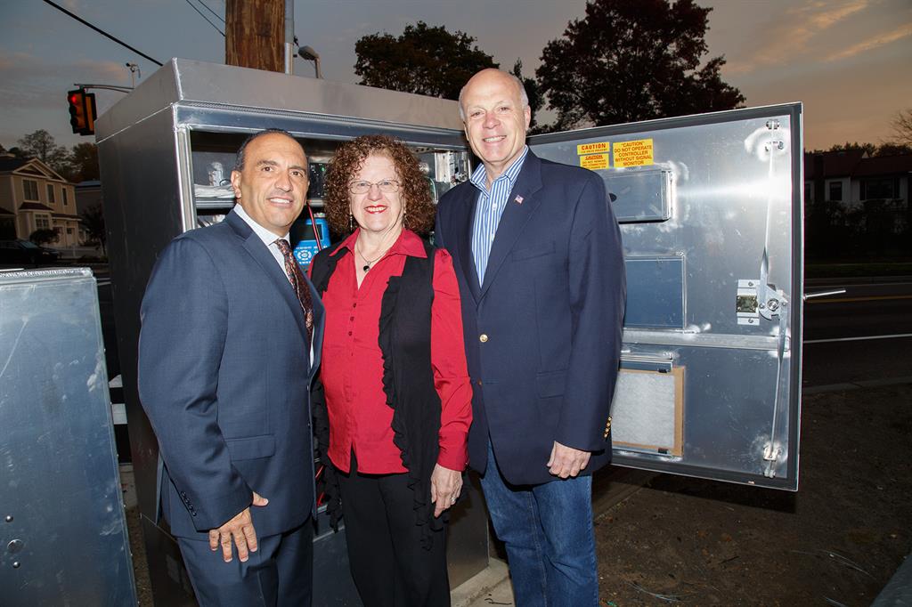 Monmouth County Freeholder Director Thomas Arnone, Spring Lake Council President Sara King and Freeholder Gary J. Rich, Sr. activate the traffic light in Spring Lake Heights
