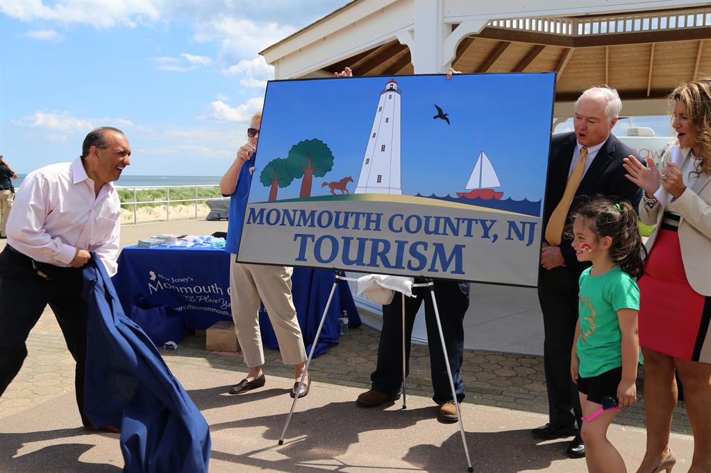 The new Monmouth County Tourism logo is unveiled by the Monmouth County Board of Chosen Freeholders.