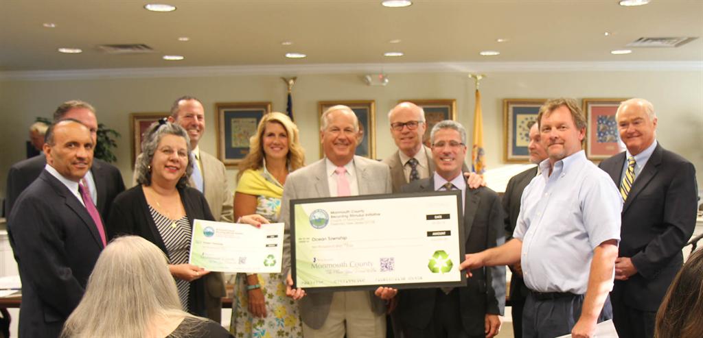 Freeholders and the Monmouth County Clean Communities staff present a $10,000 Recycling Stimulus Initiative grant to Ocean Township.Left to right: Freeholder Thomas Arnone, William Johnson (obstructed), Ocean Township Recycling Coordinator Nancy Peak, Stuart Newman, Freeholder Deputy Director Serena DiMaso, Councilman Richard Long, Freeholder Director Gary Rich, Sr., Councilman Robert Acerra, Sr., Richard Throckmorton (obstructed), Ocean Township’s Director of Public Works Tom Crochet and Freeholder John Curley.